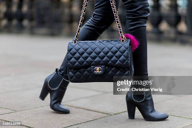 Fashion Blogger Barbora Ondrackova wearing black leggings from Balenciaga, a black Chanel bag, black heeled Chelsea ankle boots from Givenchy on...