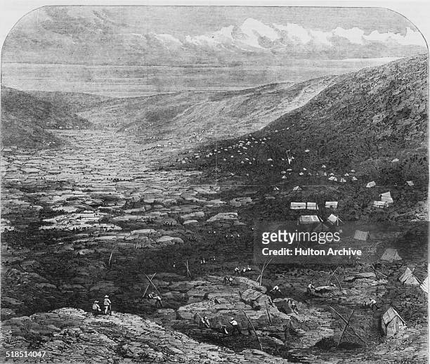 View of the Tuapeka goldfields in Otago, New Zealand, during the Central Otago Gold Rush, circa 1863.