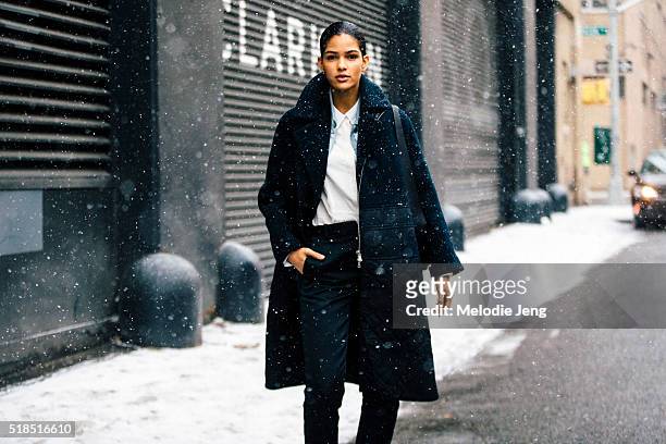Model Cris Urena attends the 3.1 Phillip Lim show in the snow during New York Fashion Week: Women's Fall/Winter 2016 on February 16, 2016 in New York...