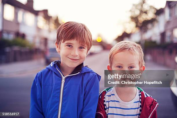 happy brothers in the early evening - six year old stock pictures, royalty-free photos & images