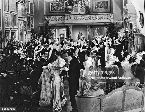 People in elegant attire dancing at a formal party, Hollywood, California, mid 1920s.