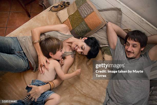 family in bed1 - sleeping toddler bed stock pictures, royalty-free photos & images