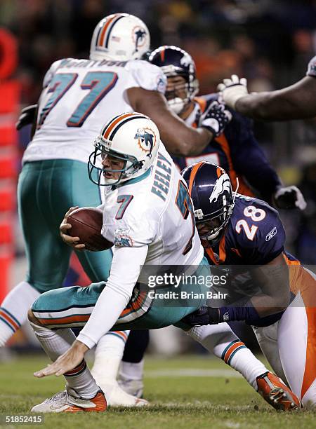 Safety Kenoy Kennedy of the Denver Broncos sacks quarterback A.J. Feeley of the Miami Dolphins on the 5-yard line late in the fourth quarter on...