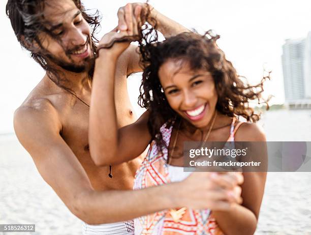 couple dancing on miami beach - salsa dancing miami stock pictures, royalty-free photos & images