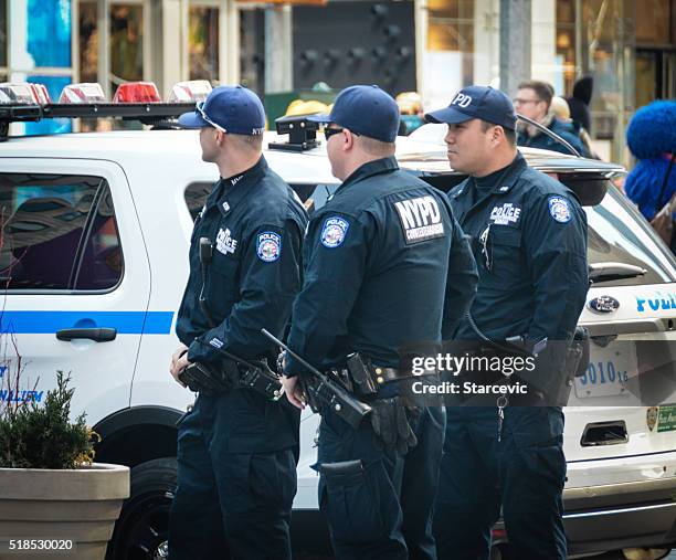 police officers on patrol in new york city - street style new york city march 2016 stock pictures, royalty-free photos & images