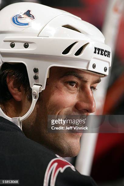 Todd Bertuzzi smiles on the bench during the Brad May and Friends Hockey Challenge at the Pacific Coliseum on December 12, 2004 in Vancouver, Canada....