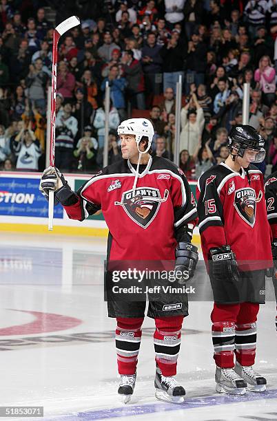 Todd Bertuzzi acknowledges the crowd while receiving a standing ovation during the Brad May and Friends Hockey Challenge at the Pacific Coliseum on...