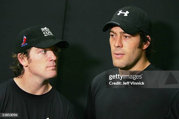 Todd Bertuzzi and Brad May of the Vancouver Canucks talk to the media after the Brad May and Friends Hockey Challenge at the Pacific Coliseum on...