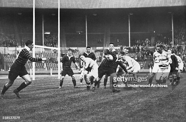 Scene from the Rugby League Challenge Cup Final held at Wembley Stadium between York and Halifax, London, England, May 1931. Here a York player is...