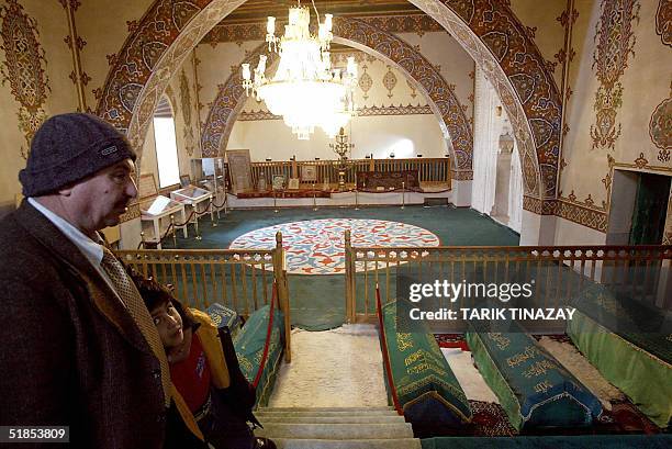 An Alevi father and son visit the mausoleum of Haci Bektash Veli, founder of the Muslim Bektashi order in the 14th century, 13 December 2004 in...