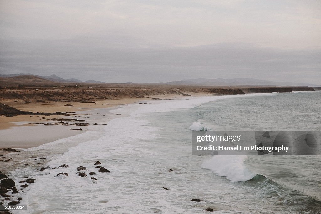 Cloudy beach with waves