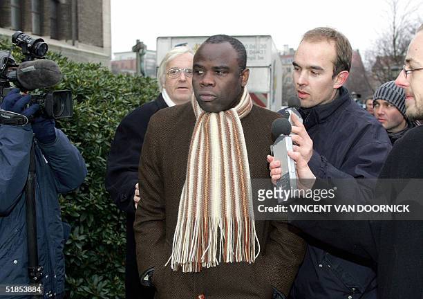 Former Marseille Olympic's Basile Boli arrives at the Basilique of Koekelberg, in Brussels, for the funeral service of late soccer coach Raymond...