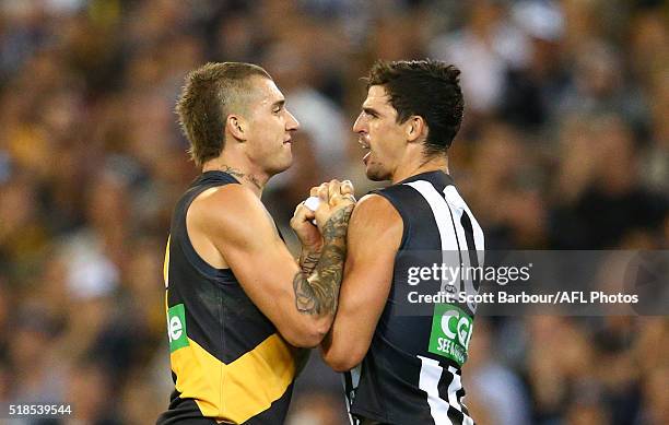 Dustin Martin of the Richmond Tigers and Scott Pendlebury of the Collingwood Magpies wrestle during the round two AFL match between the Collingwood...