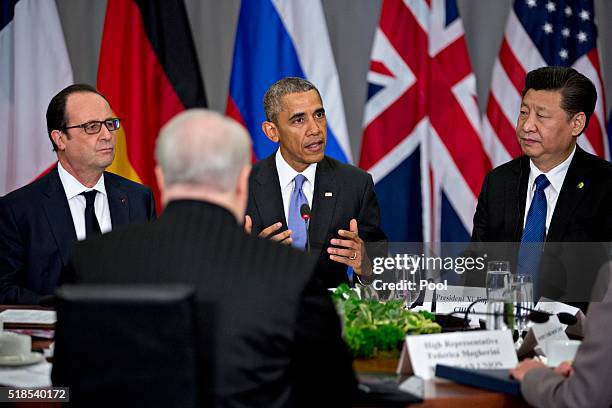 President Barack Obama speaks as Xi Jinping, China's president , and Francois Hollande, France's president , listen during a P5+1 multilateral...