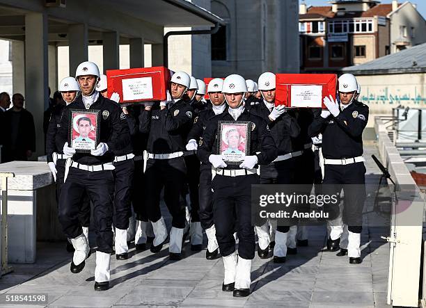 People attend the funeral ceremony of martyred policemen Necdet Alici, Mustafa Yigitalp, Mehmet Fatih Ertugrul and Alper Zor at Kocatepe Mosque in...