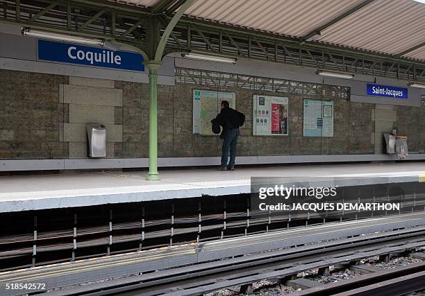 Picture taken on April 1, 2016 in Paris metro shows a fake station's name "Coquille" put next to "Saint-Jacques" in a word play with "scallop" by the...