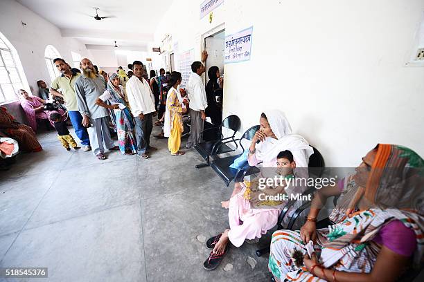 Patients queued up at OPD at a Bareilly district hospital to show their children suffering from Non Polio Acute Flaccid Paralysis on July 3, 2015 in...