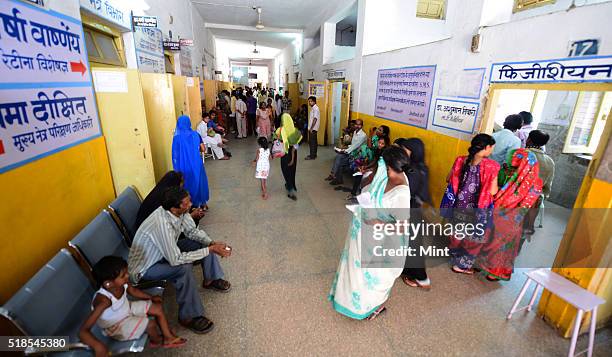 Patients queued up at OPD at a Bareilly district hospital to show their children suffering from Non Polio Acute Flaccid Paralysis on July 3, 2015 in...