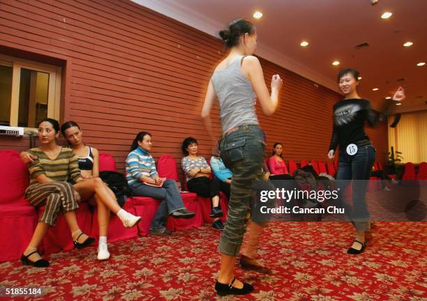 Contestants take a break at a training session during China's first ever Miss Plastic Surgery contest on December 13, 2004 in Beijing, China. 19...