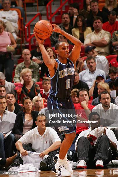 Howard Eisley of the Utah Jazz controls the ball against the Miami Heat during the game at American Airlines Arena on November 19, 2004 in Miami,...