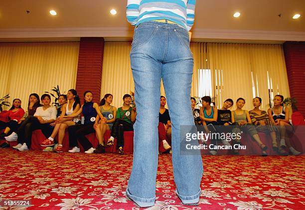 Contestants listening to a teacher at a training session during China's first ever Miss Plastic Surgery contest on December 13, 2004 in Beijing,...