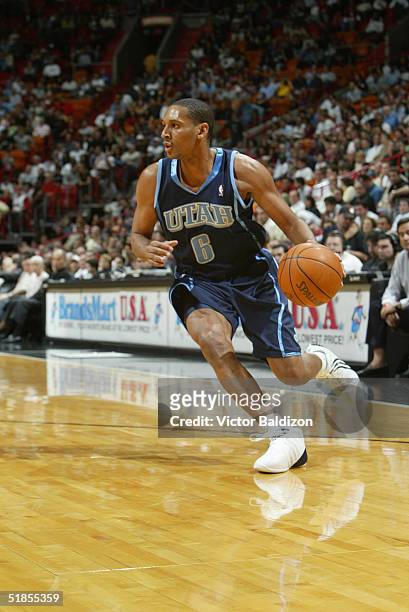 Howard Eisley of the Utah Jazz drives against the Miami Heat during the game at American Airlines Arena on November 19, 2004 in Miami, Florida. The...