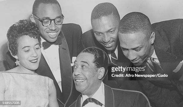 Andy Williams, Mrs William Mason, D Williams and African-American composer, pianist, bandleader and Jazz musician Duke Ellington playing the piano...