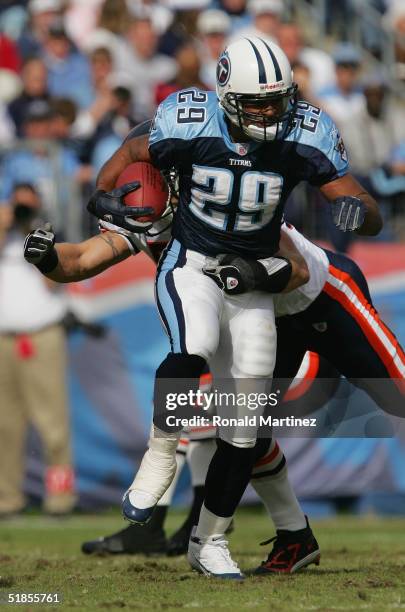 Running back Chros Brown of the Tennessee Titans carries the ball against the Chicago Bears during the game on November 14, 2004 at The Coliseum in...