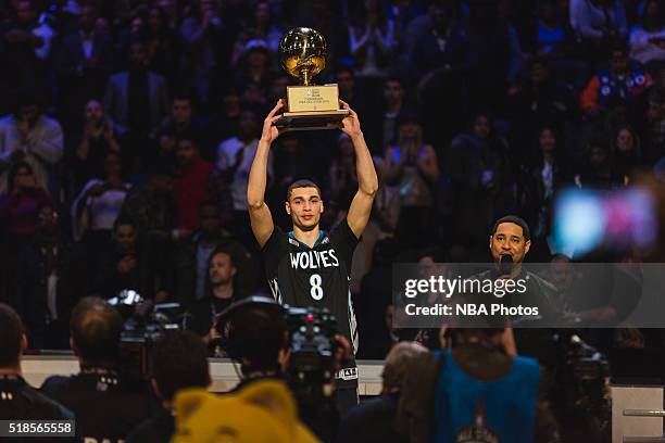 Zach LaVine of the Minnesota Timberwolves celebrates by holding up his trophy after winning the Verizon Slam Dunk Contest during State Farm All-Star...