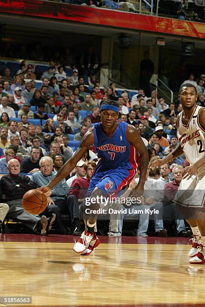 Smush Parker of the Detroit Pistons drives around Dajuan Wagner of the Cleveland Cavaliers during the game at Gund Arena on November 24, 2004 in...