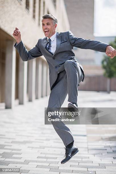 excited business man - skipping along stock pictures, royalty-free photos & images