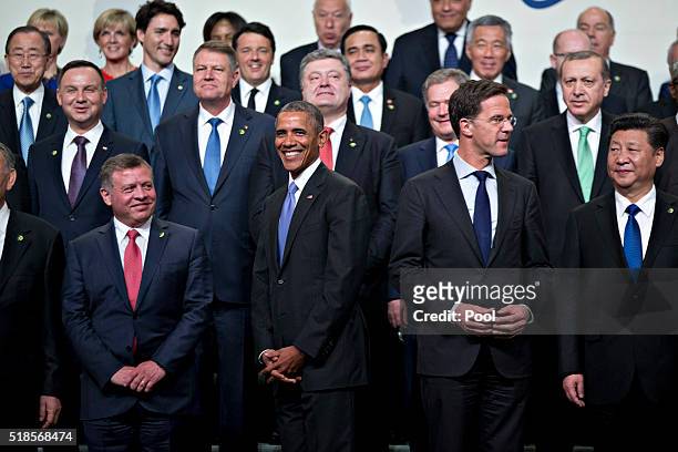 King Abdullah II ibn Al Hussein of Jordan, U.S. President Barack Obama, Dutch prime minister Mark Rutte and China's president Xi Jinping stand during...