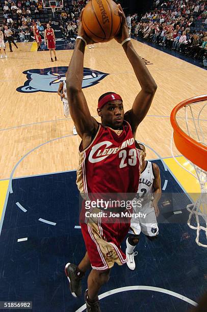 LeBron James of the Cleveland Cavaliers goes up for a dunk during a game against Lorenzen Wright of the Memphis Grizzlies on December 13, 2004 at...