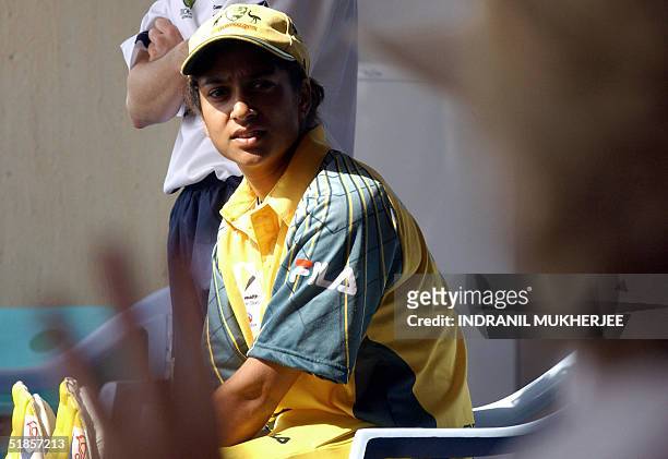 In this picture taken 11 December 2004, Indian-born Australian woman cricketer Lisa Sthalekar listens to instructions from the team coach before...