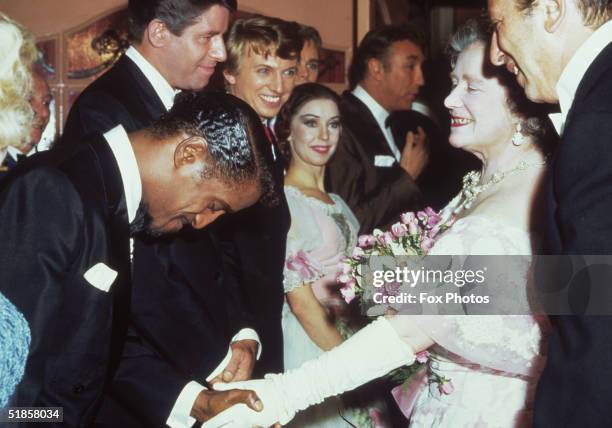 The Queen Mother shakes hands with Sammy Davis Jnr , Jerry Lewis and Tommy Steele backstage at the Royal Variety Show, 14th November 1966. Also...