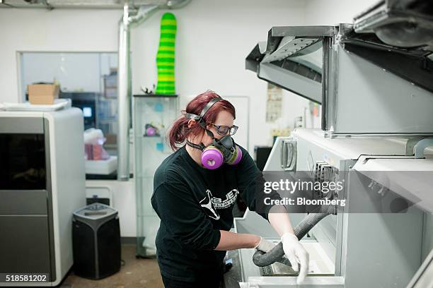 Technician removes additive from the 3D printer for re-use at the Objex Unlimited studio in Toronto, Ontario, Canada, on Tuesday, March 29, 2016....