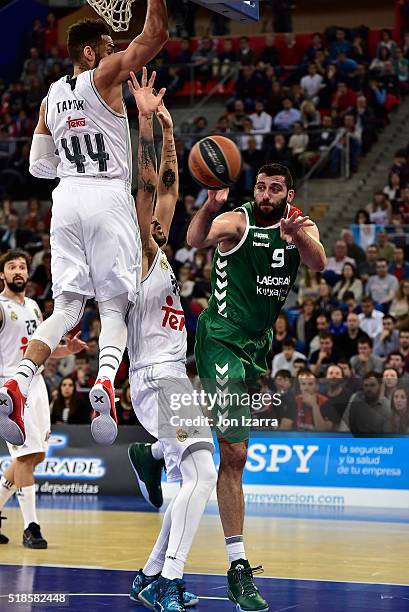 Jeffery Taylor, #44 of Real Madrid competes with Gustavo Ayon, #14 of Real Madrid and Ioannis Bourousis, #9 of Laboral Kutxa Vitoria Gasteiz in...