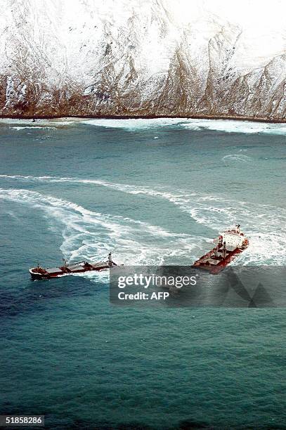 This 13 December, 2004 US Coast Guard image shows the two halves of the wrecked Malaysian freighter Selendang Ayu near Unalaska Island, Alaska. The...