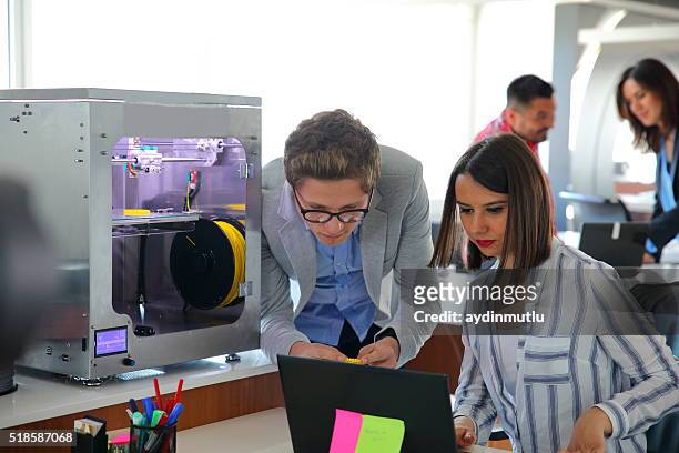 young business people working in 3d printer office - 3 d printer stock pictures, royalty-free photos & images