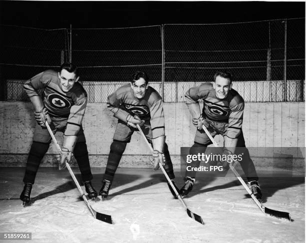 The first forward line of the Canadian Olympic ice hockey team which went on to win the gold at the Fifth Winter Olympics Ab Renaud, Ted Hibberd, and...