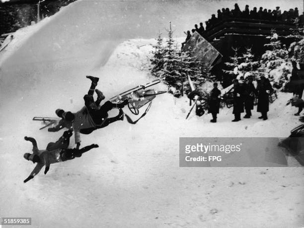 Photo shows the Italian Olympic bobsled 'Italia 2' as it hurtles through the air on the 'Bayern' curve and tosses its crew of Francesco de Zanna,...