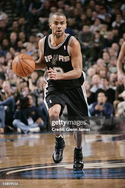 Tony Parker of the San Antonio Spurs moves the ball during the game with the Dallas Mavericks November 30, 2004 at the American Airlines Center in...