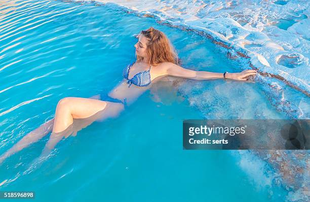 young woman enjoying pamukkale, turkey. - swimsuit models girls stock pictures, royalty-free photos & images