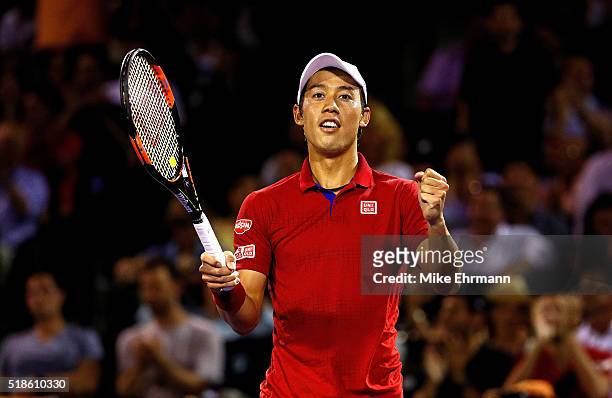 Kei Nishikori of Japan celebrates winning a semifinal match against Nick Kyrgios of Australia during Day 12 of the Miami Open presented by Itau at...