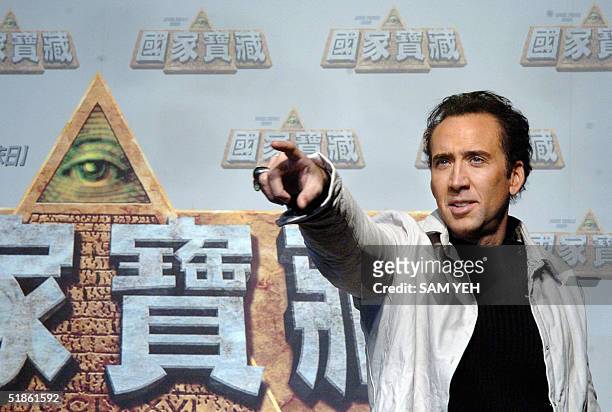 Hollywood actor Nicolas Cage gestures during a press conference to promote his new film "National Treasure" in Taipei, 15 December 2004. Cage...