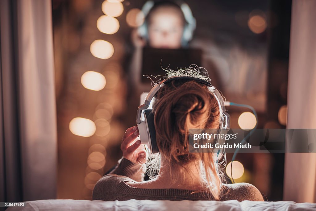 Woman using tablet pc in evening.