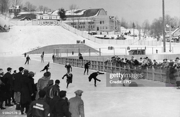 American skater Irving Jaffee crossing the finish line during the second heat of the Men's 10,000-Metre Speed Skating competition at the Winter...