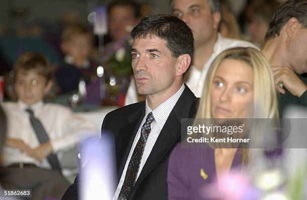 Former Utah Jazz point guard John Stockton and his wife Nada listen to a speaker at a dinner for Stockton's jersey retirement November 21, 2004 at...