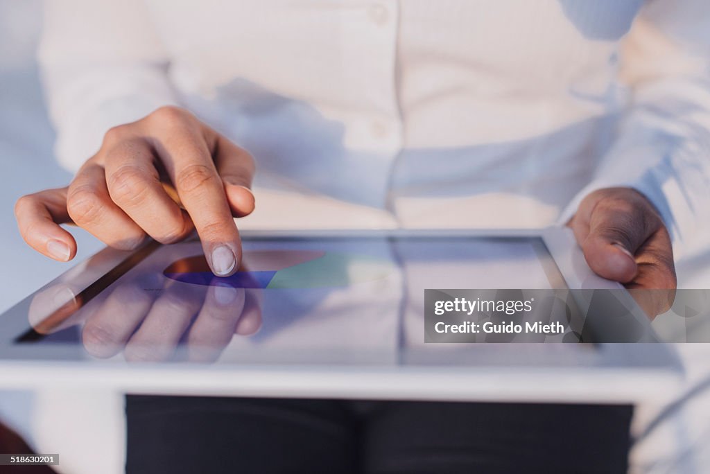 Businesswoman using tablet pc.