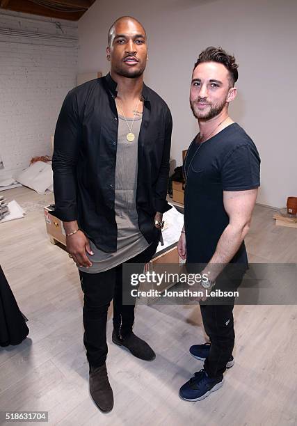 Professional football player Larry English and guest attend the STAMPD store opening on April 1, 2016 in Los Angeles, California.